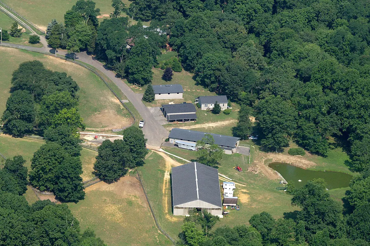 Nearaway Farm from the air, showing the barns and the fenced paddocks with lanes between them